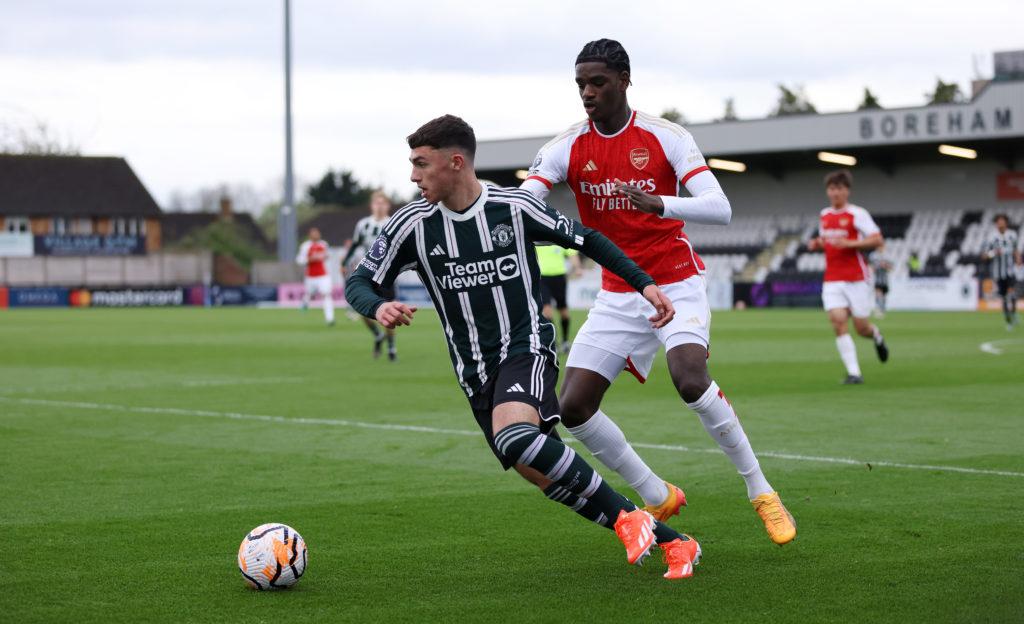 James Scanlon of Manchester United is put under pressure by Ayden Heaven of Arsenal during the Premier League 2 Play off match between Arsenal U21 ...