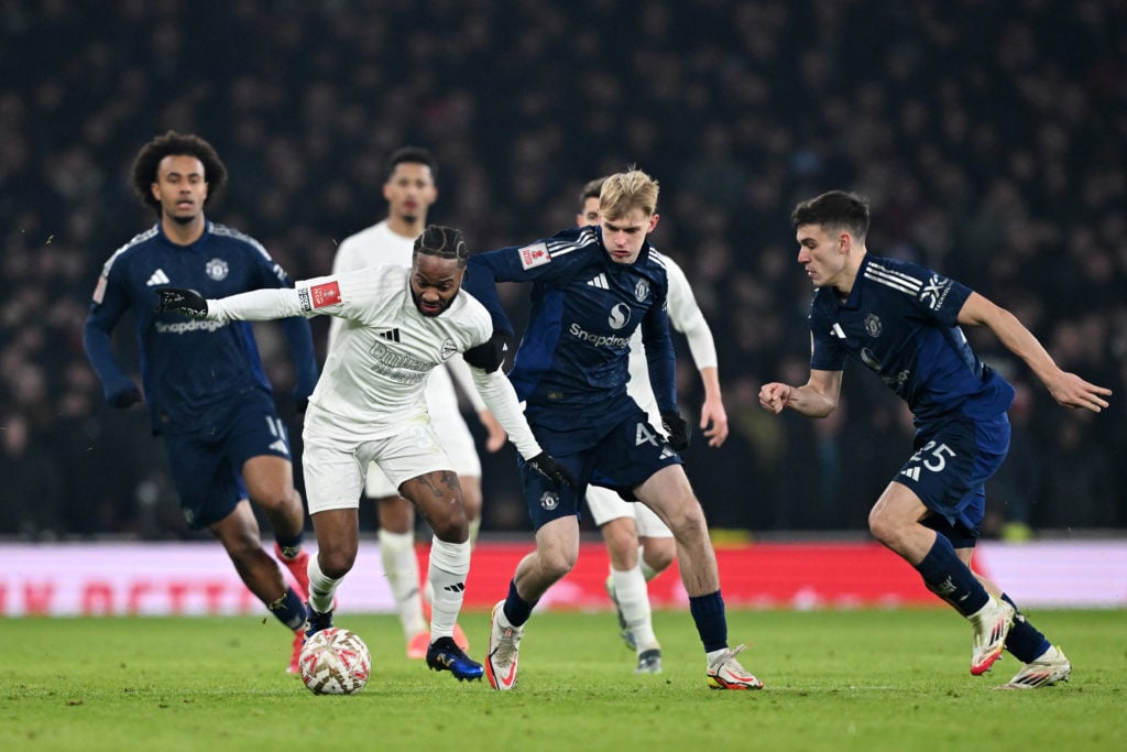 Raheem Sterling of Arsenal is challenged by Toby Collyer of Manchester United during the Emirates FA Cup third round match between Arsenal and Manc...