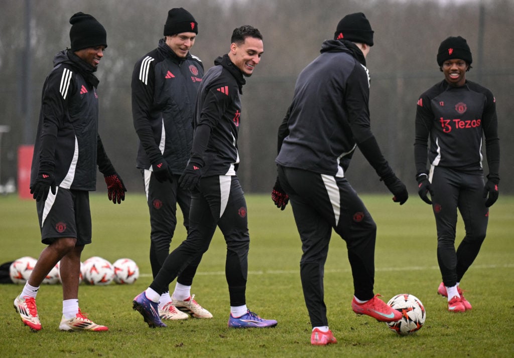 Amad Diallo (L), Manchester United's Swedish defender #02 Victor Lindelof (2L), Manchester United's Brazilian midfielder #21 Antony (C) and Manchester United's Dutch defender #12 Tyrell Malacia (R) take part in a training session at the Carrington Training Complex in Manchester, north-west England on January 22, 2025