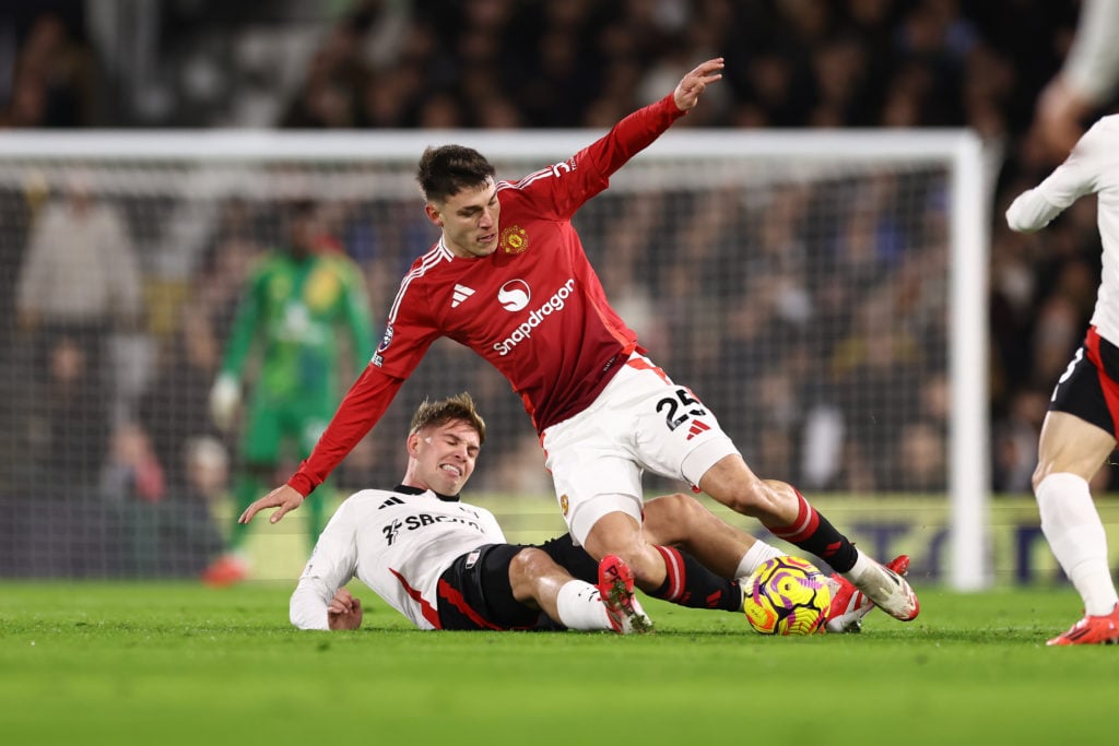 Emile Smith Rowe of Fulham tackles Manuel Ugarte of Manchester United during the Premier League match between Fulham FC and Manchester United FC at...