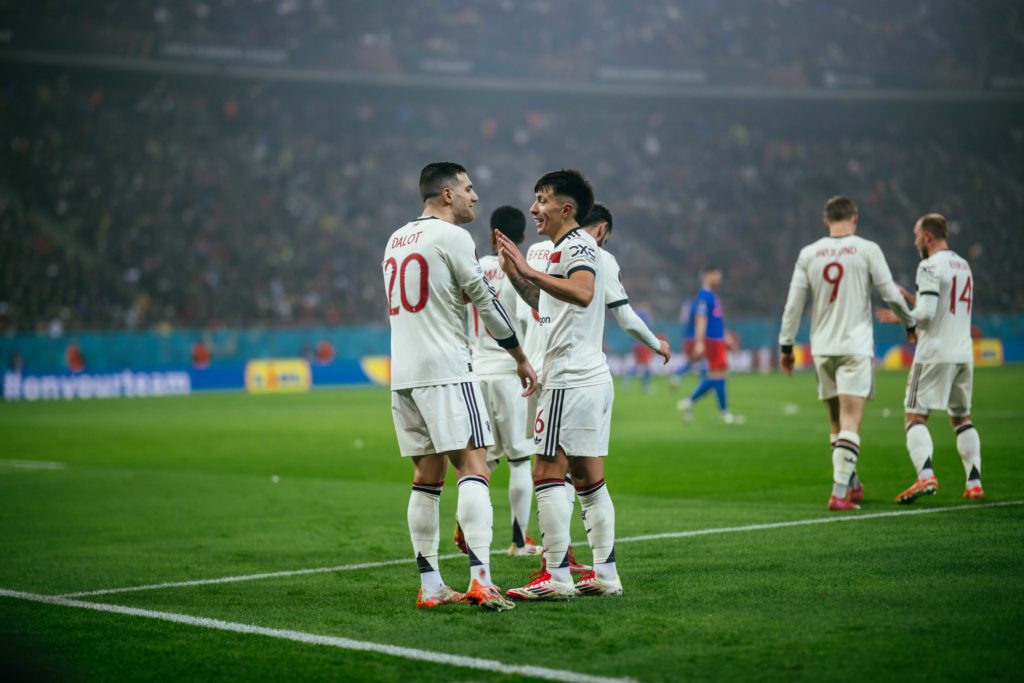 Diogo Dalot of Manchester United celebrates scoring a goal to make the score 0-1 with Lisandro Martinez during the UEFA Europa League 2024/25 Leagu...