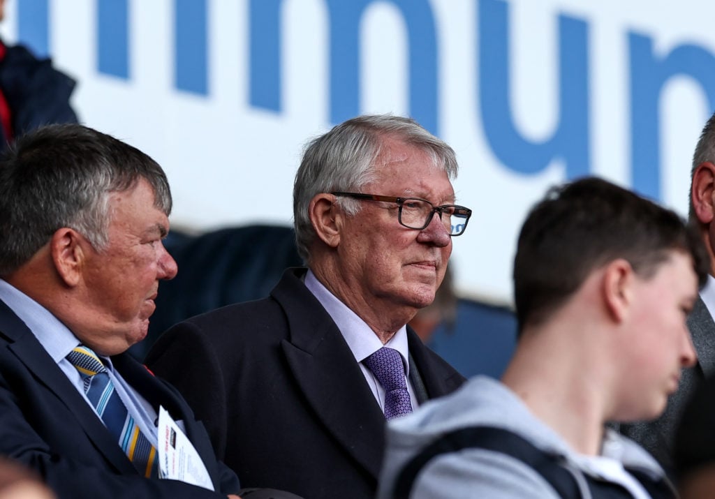 Sir Alex Ferguson stands to observe the playing of the Last Post during the Sky Bet League One match between Bolton Wanderers FC and Peterborough U...