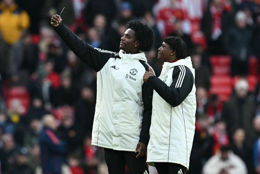 Manchester United's English defender #26 Ayden Heaven (L) takes a selfie photograph of himself and Manchester United's Danish defender #13 Patrick ...