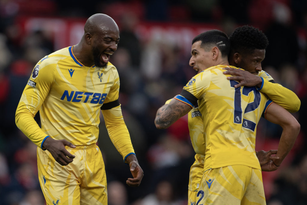 Jean-Philippe Mateta of Crystal Palace celebrates with team mate Daniel Munoz after the final whistle of the Premier League match between Manchester United FC and Crystal Palace FC at Old Trafford on February 2, 2025