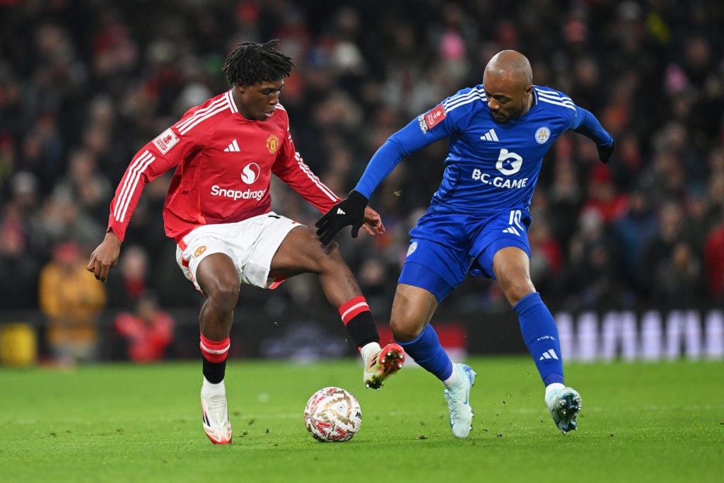 Patrick Dorgu of Manchester United is challenged by Jordan Ayew of Leicester City during the Emirates FA Cup Fourth Round match between Manchester ...