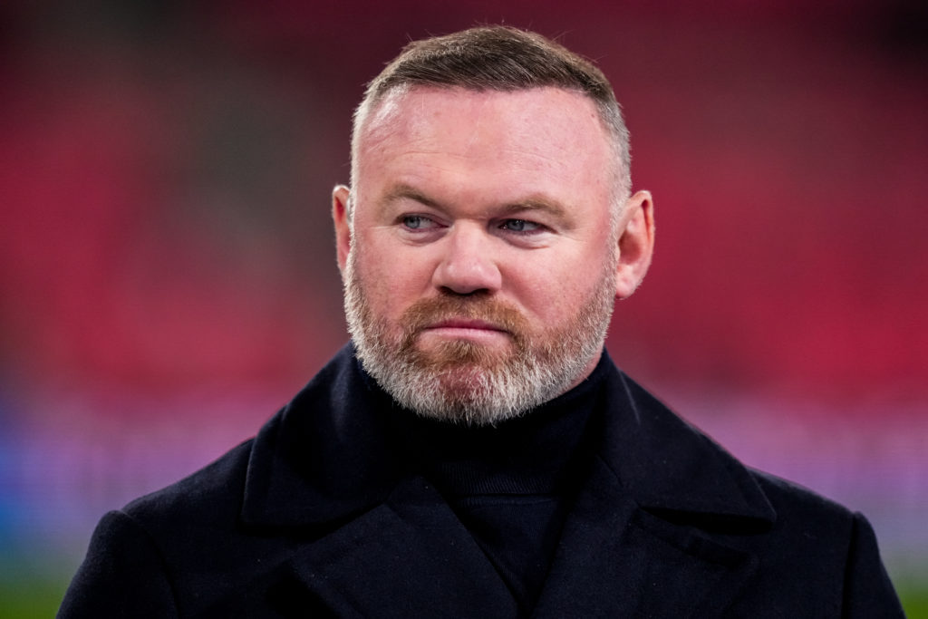 Former footballer and TV pundit for Amazon Prime Wayne Rooney looks on prior to the Champions League match between PSV Eindhoven and Arsenal at the Philips Stadion in 2025 in Eindhoven, Netherlands.