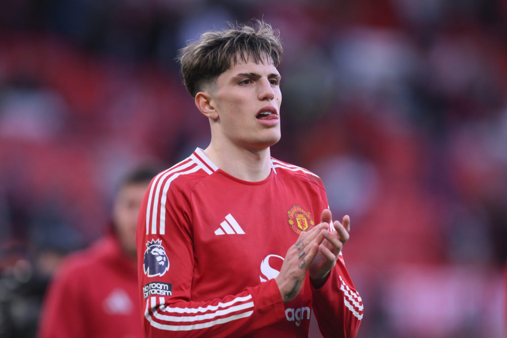 Alejandro Garnacho applauds fans as Manchester United face Manchester City.