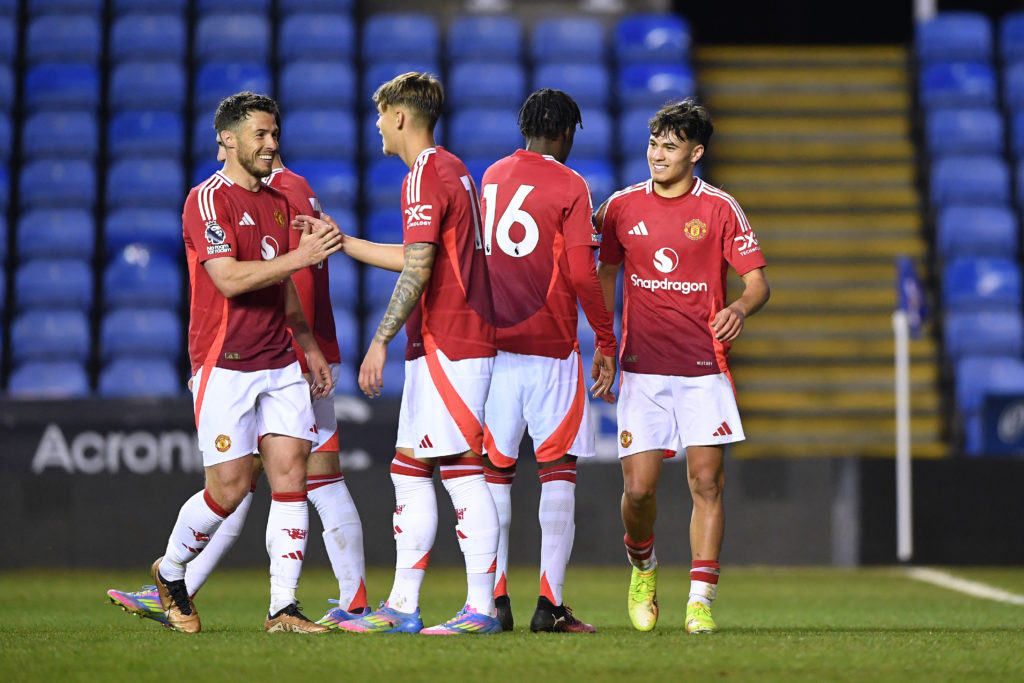 Gabriele Biancheri of Manchester United celebrates with teammate Bendito Mantato after scoring his team's third goal during the Premier League 2 match between Reading U21 and Manchester United U21 at Select Car Leasing Stadium on April 11, 2025