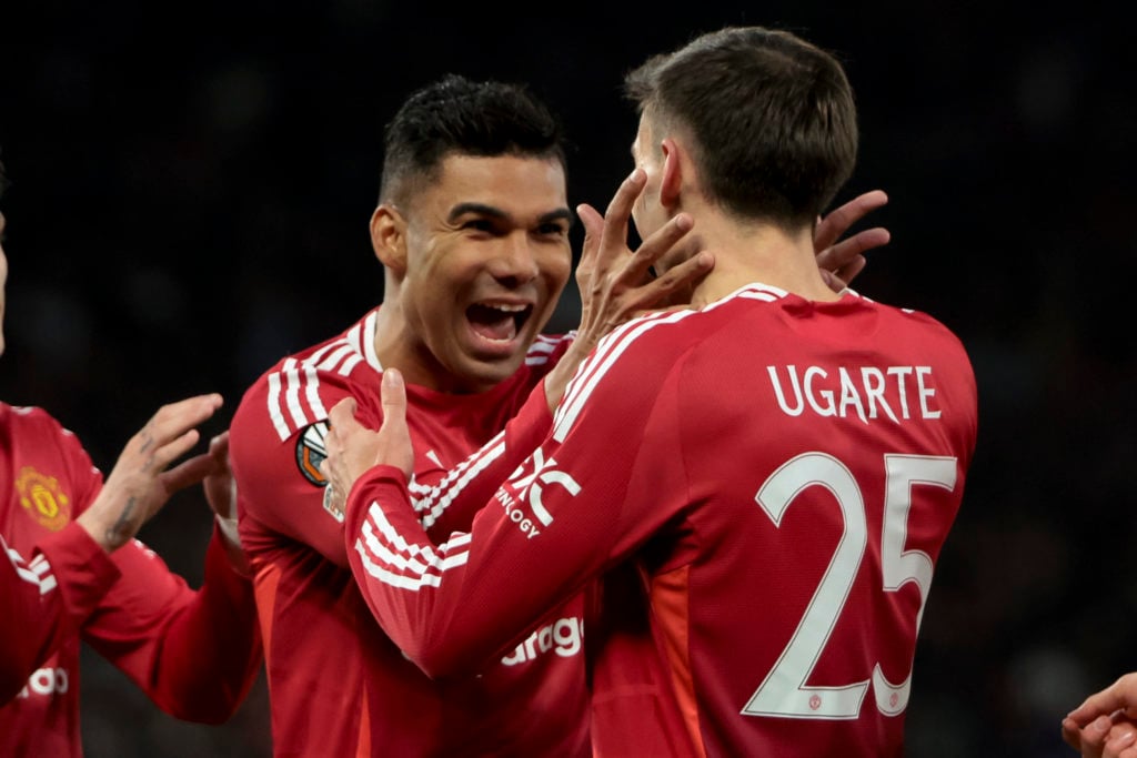Manchester United midfielders Casemiro and Manuel Ugarte celebrate together during the Europa League.