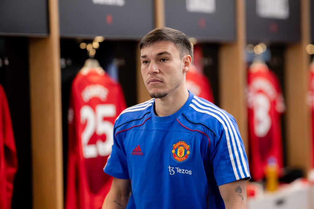 Manuel Ugarte wears blue polo shirt in Manchester United dressing room