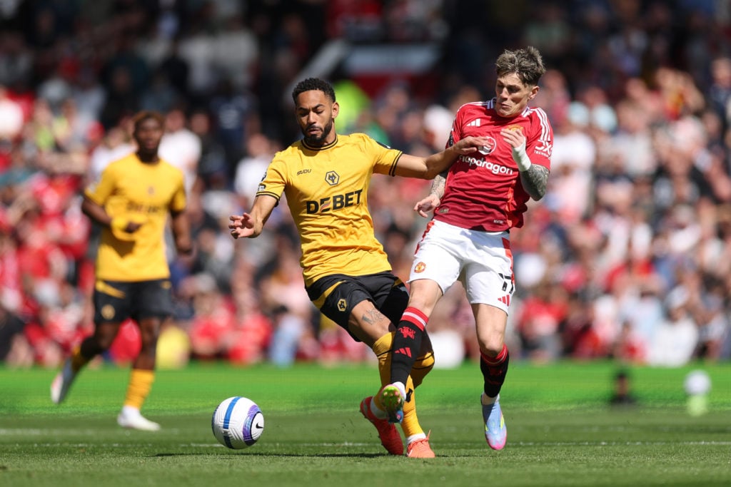 Matheus Cunha of Wolverhampton Wanderers battles for possession with Alejandro Garnacho of Manchester United