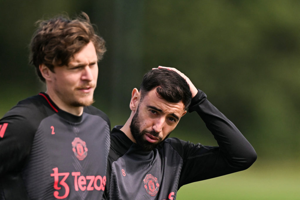 Manchester United’s Portuguese midfielder Bruno Fernandes reacts behind Manchester United’s Swedish defender Victor Lindelof as he takes part in a team training session at the Carrington training complex in Manchester, north-west England, on 14th May 2025 during a media day ahead of their UEFA Europa League final against Tottenham Hotspur. The UEFA Europa League final will take place on May 21 in Bilbao.