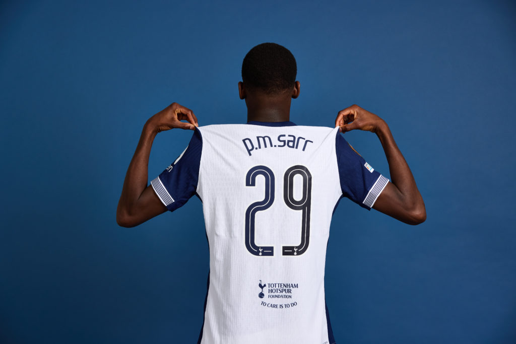 Pape Matar Sarr shows off shirt from behind during Tottenham Hotspur Finalist Access Day - UEFA Europa League 2025 Final