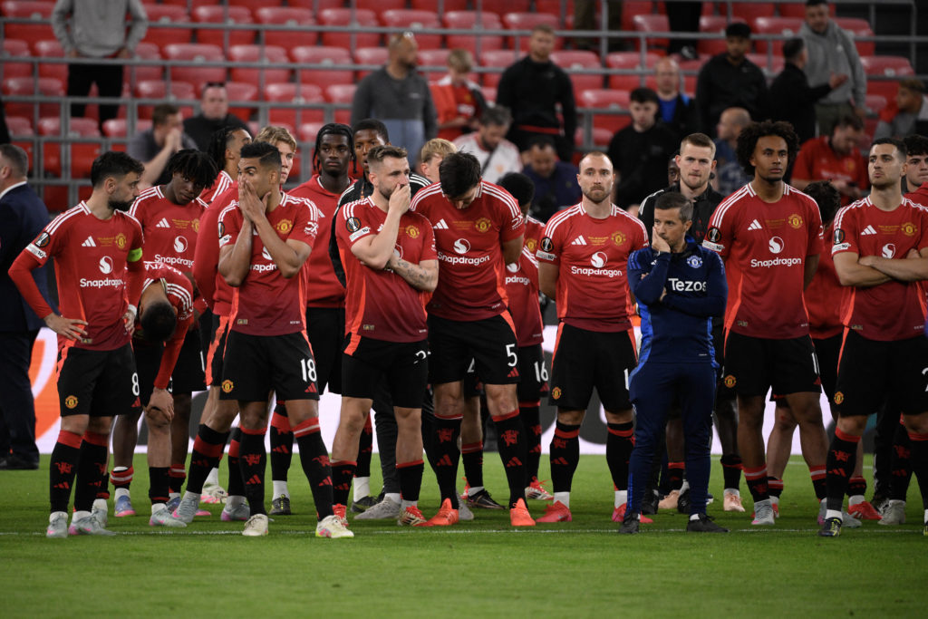 Manchester United players react to being defeated after the UEFA Europa League final football match between Tottenham Hotspur and Manchester United at San Mames Stadium in Bilbao on May 21, 2025.