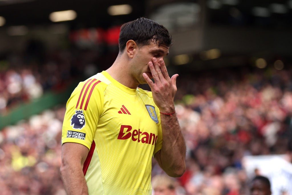 Emiliano Martinez leaves the pitch after being shown a red card for a foul on Rasmus Hojlund during the Premier League match between Manchester United and Aston Villa at Old Trafford in 2025 in Manchester.