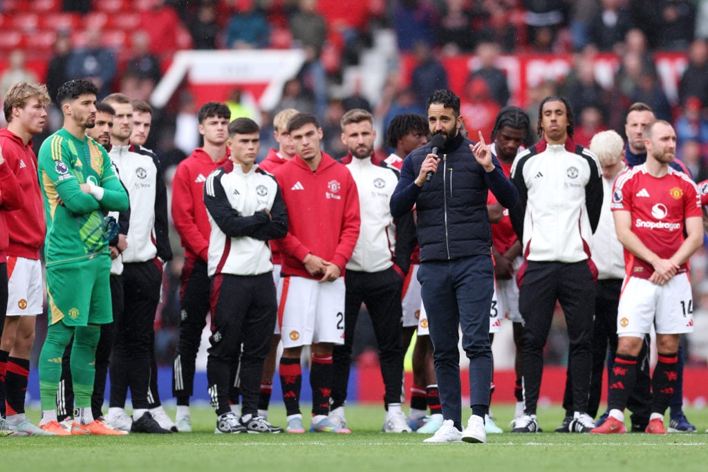 Ruben Amorim, manager of Manchester United, speaks to the fans as players of Manchester United huddle on the pitch after the Premier League match between Manchester United FC and Aston Villa FC at Old Trafford on May 25, 2025, in Manchester, England.