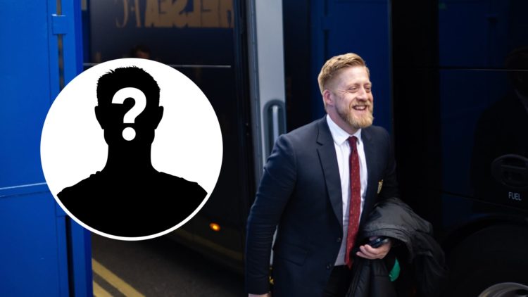 Nick Cox walking in Manchester United suit with mystery player icon inset.