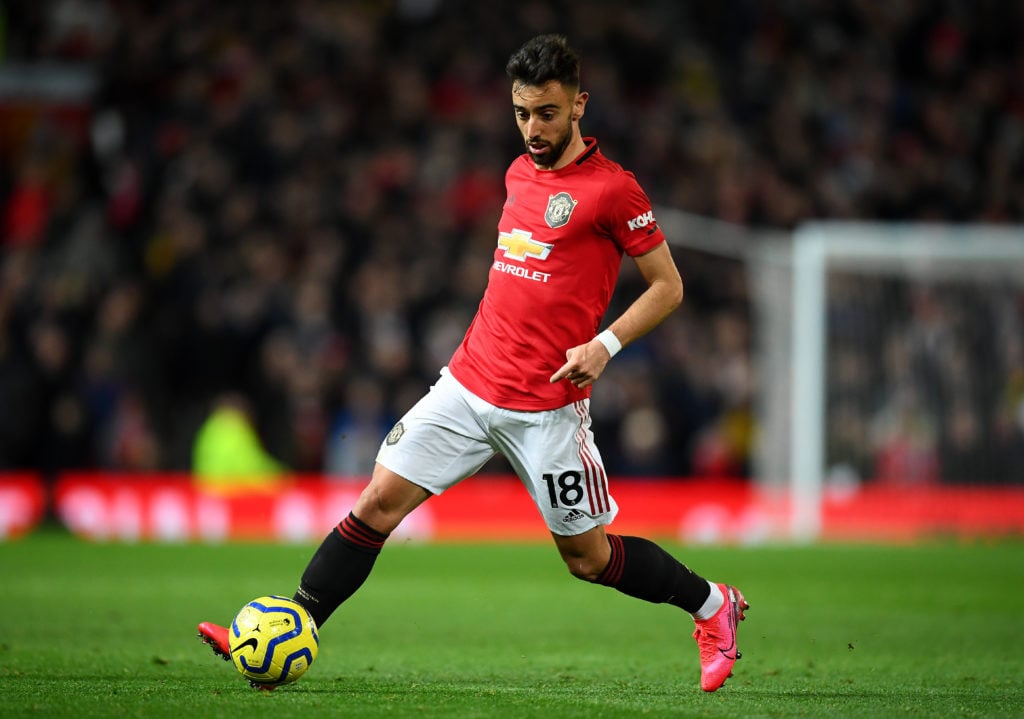 Bruno Fernandes runs with the ball for Manchester United, 2020