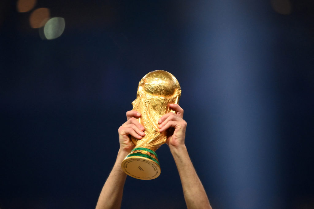 A player of Argentina lifts the World Cup trophy during the Qatar 2022 World Cup trophy ceremony after the football final match between Argentina and France at the Lusail Stadium in Lusail, north of Doha, on December 18, 2022. Argentina won in the penalty shootout.