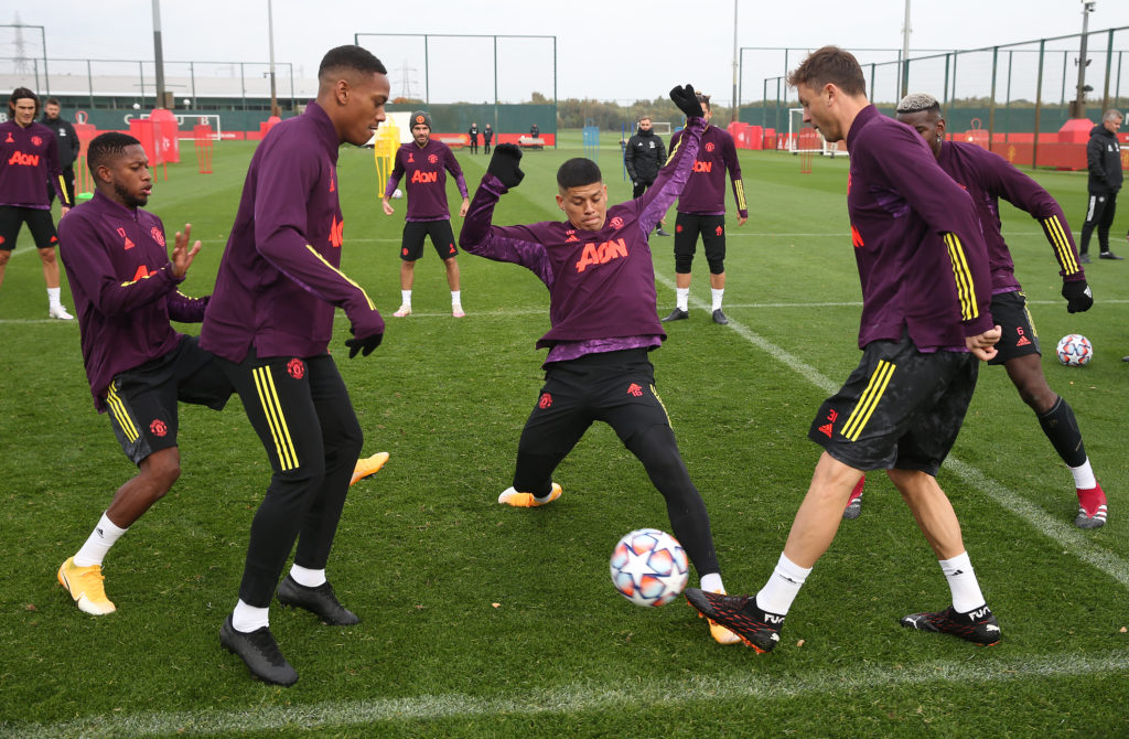 Fred, Anthony Martial, Marcos Rojo, Nemanja Matic of Manchester United in action during a first team training session