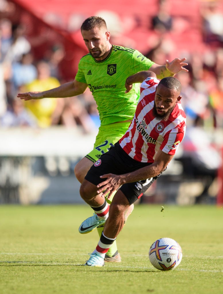 Bryan Mbeumo and Luke Shaw battle for the ball during Manchester United vs Brentford in 2022.