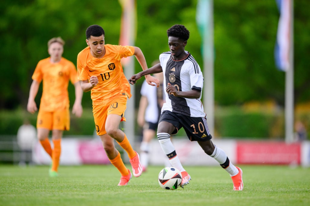 Netherlands Under-15 midfielder Abdellah Ouazane chases Germany's Jeremiah Debrah.
