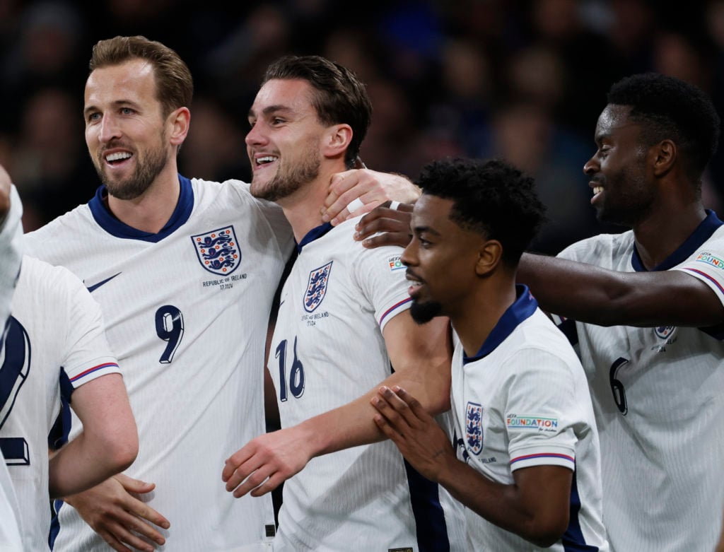 Taylor Harwood-Bellis of England celebrates with teammates Harry Kane and Angel Gomes