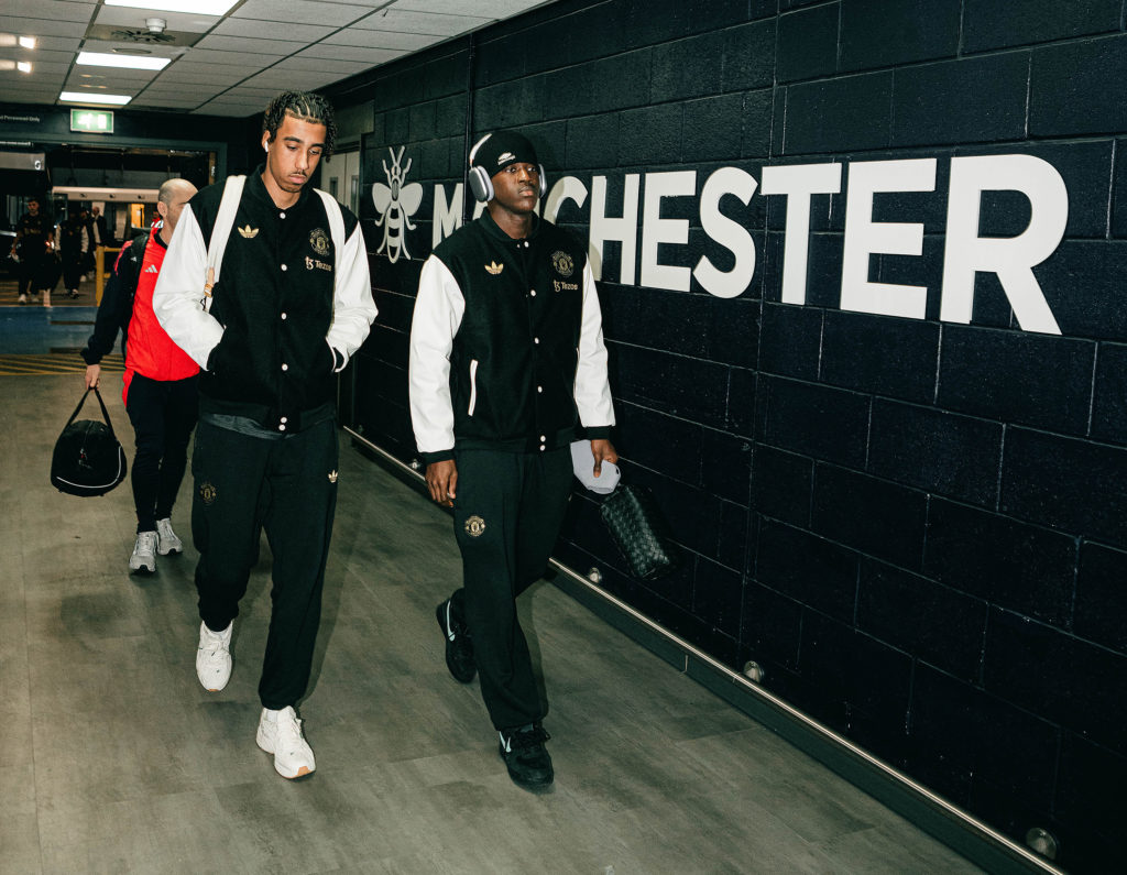 Kobbie Mainoo and Leny Yoro arrive together in Manchester United jackets.