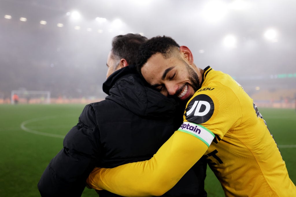 Vitor Pereira, head coach of Wolverhampton Wanderers (L) and Matheus Cunha of Wolverhampton Wanderers celebrate victory following the Premier League match between Wolverhampton Wanderers FC and Manchester United FC at Molineux