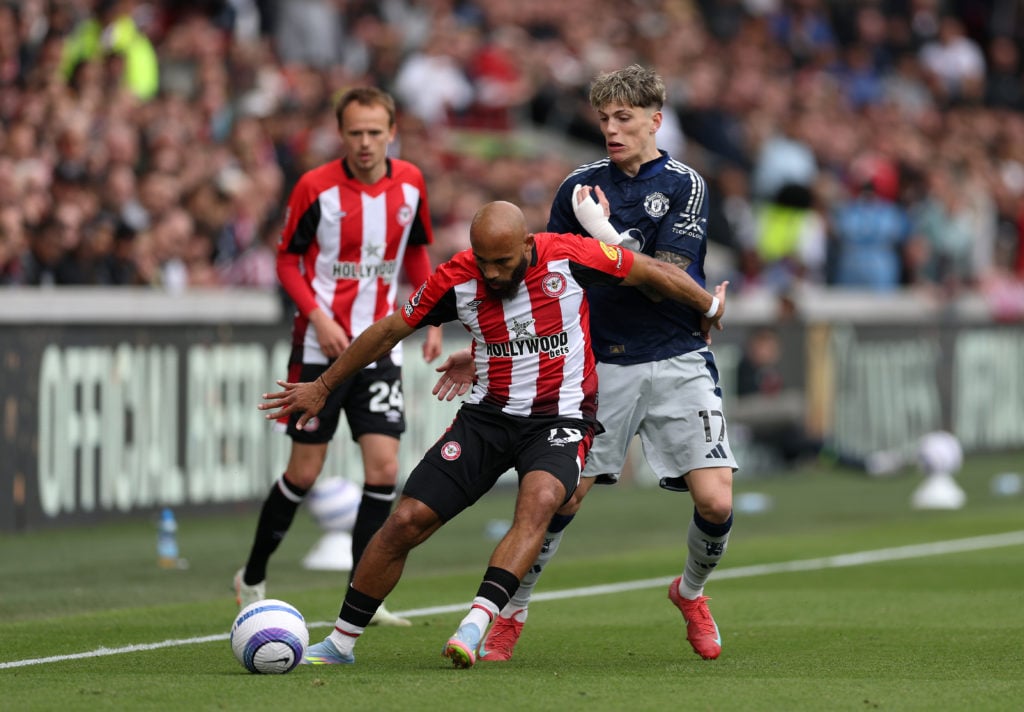 Bryan Mbeumo shields the ball from Alejandro Garnacho