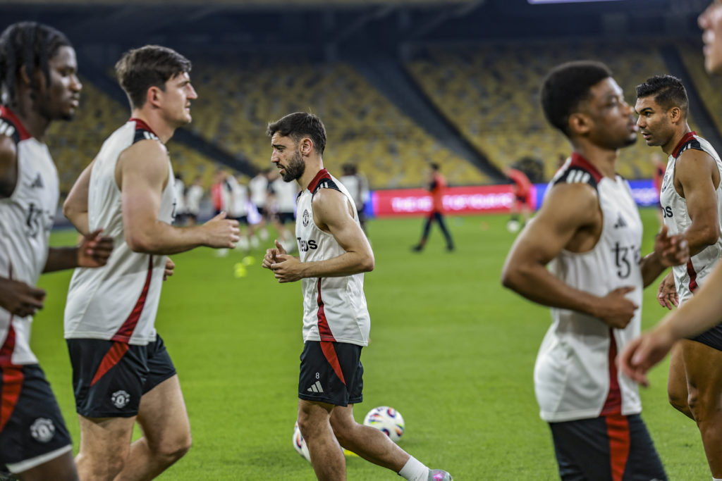 Bruno Fernandes (C) is together with his team Ayden Heaven (L), Harry Maguire (2nd L), Amad Diallo (2nd R), and Casemiro (R) in action during the official Man Utd training session
