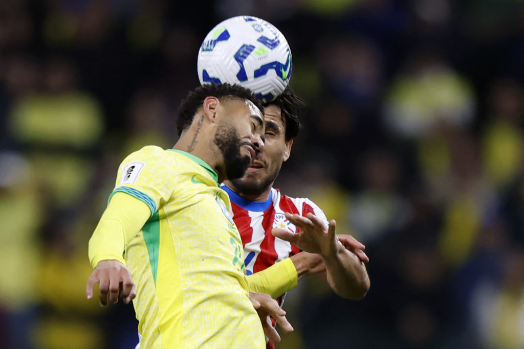 Brazil's Matheus Cunha and Paraguay's defender Junior Alonso fight for the ball.
