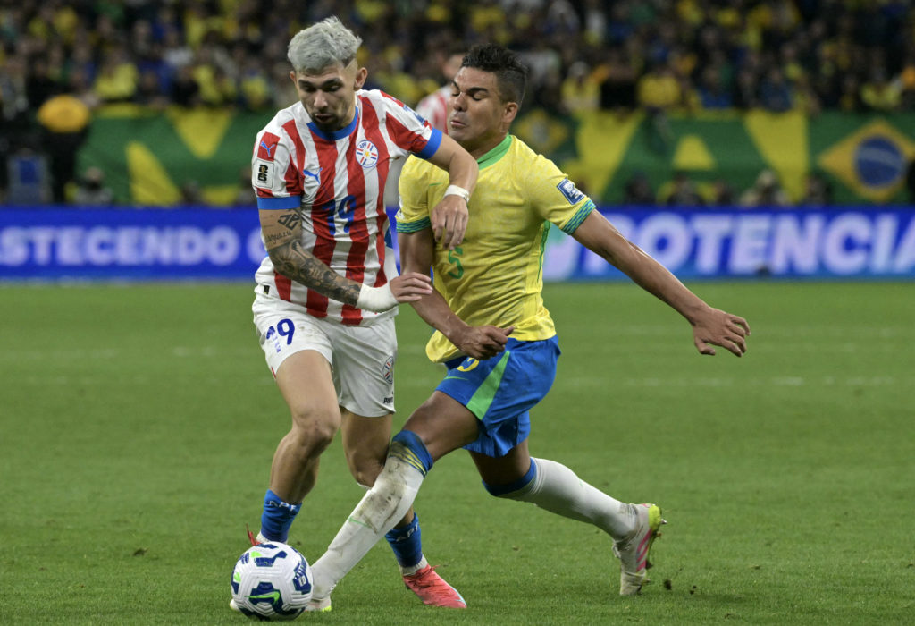 Paraguay Julio Enciso and Brazil midfielder Casemiro fight for the ball during the 2026 FIFA World Cup South American qualifier match between Brazil and Paraguay at the Neo Quimica Arena in Sao Paulo, Brazil, on June 10, 2025.