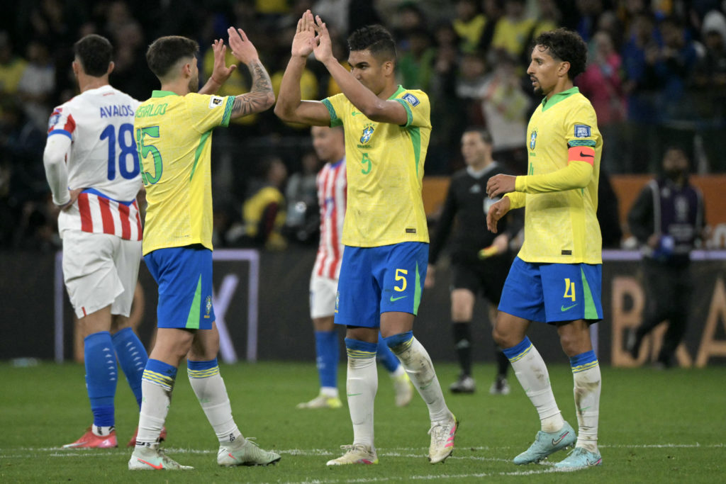 Brazil defender Lucas Beraldo, midfielder Casemiro and defender Marquinhos celebrate after winning the 2026 FIFA World Cup South American qualifying football match between Brazil and Paraguay at the Neo Quimica Arena in Sao Paulo, Brazil, on June 10, 2025.