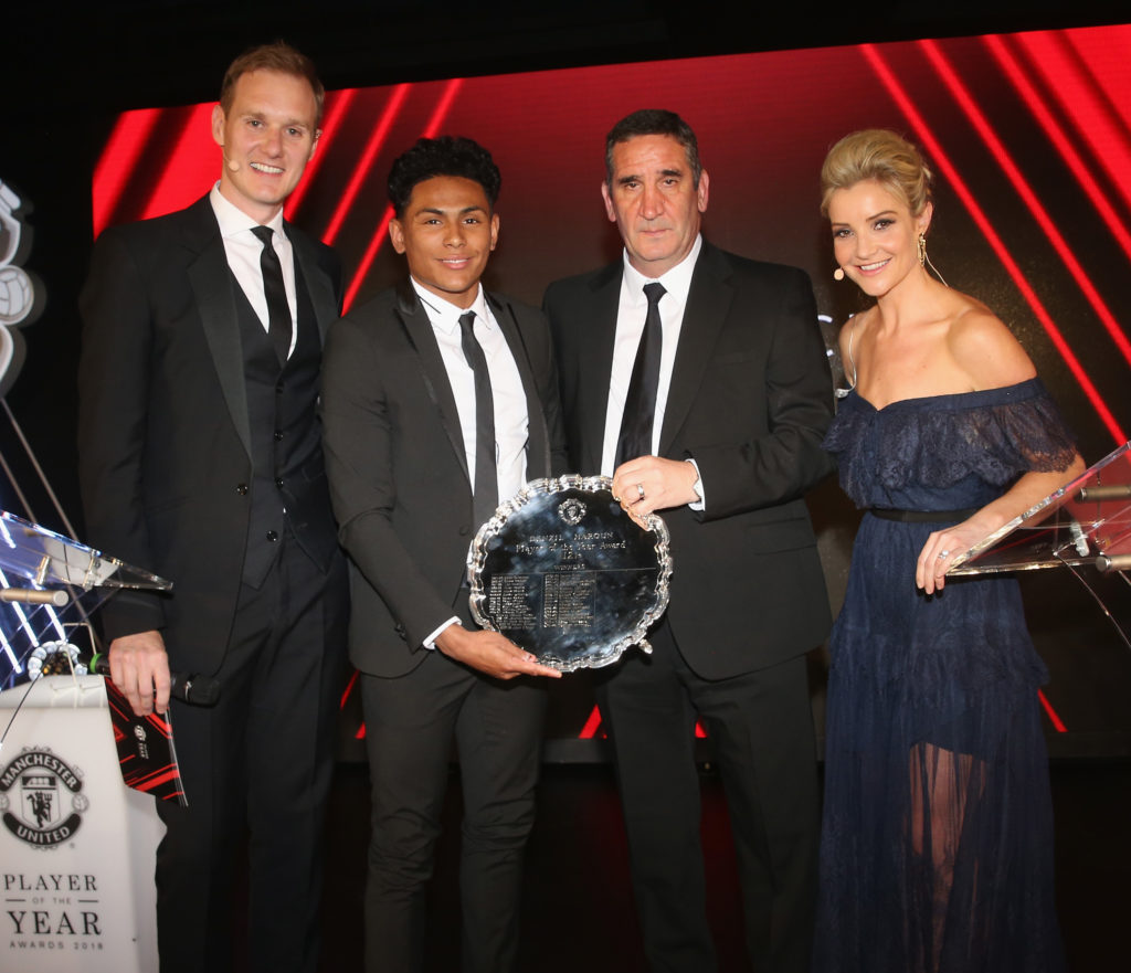 Demetri Mitchell of Manchester United is presented with the Denzil Haroun Reserve Team Player of the Season award by U23s manager Ricky Sbragia at the club's annual Player of the Year awards at Old Trafford on May 1, 2018