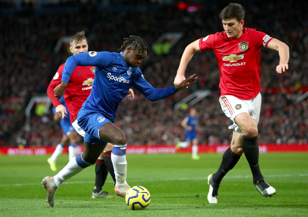 Moise Kean of Everton is put under pressure by Harry Maguire of Manchester United during the Premier League match between Manchester United and Everton FC at Old Trafford on December 15, 2019