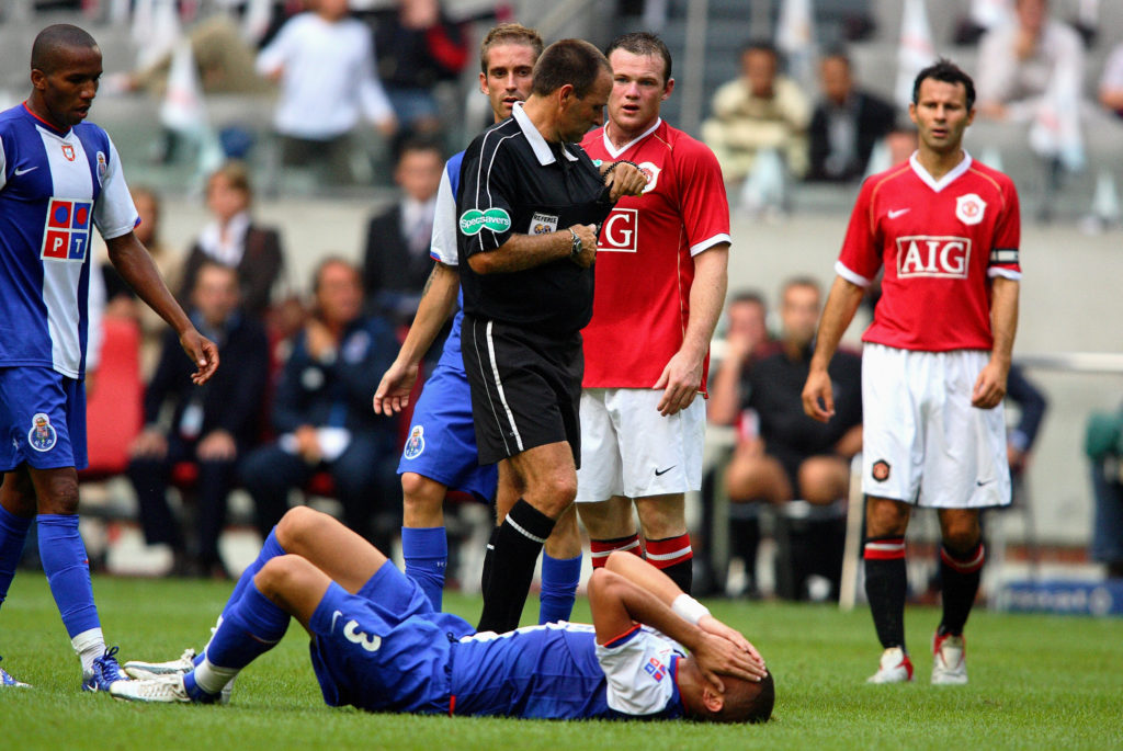 Wayne Rooney receiving red card for tackle during Manchester United vs Porto in 2006.
