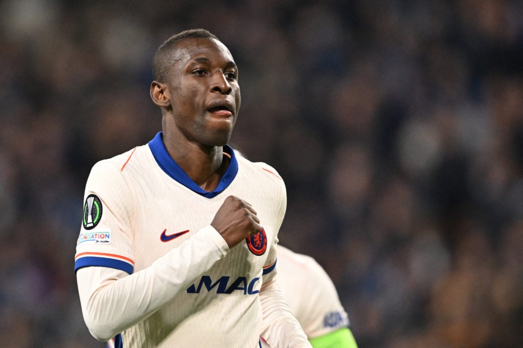 Chelsea striker Nicolas Jackson celebrates scoring with clenched fist.