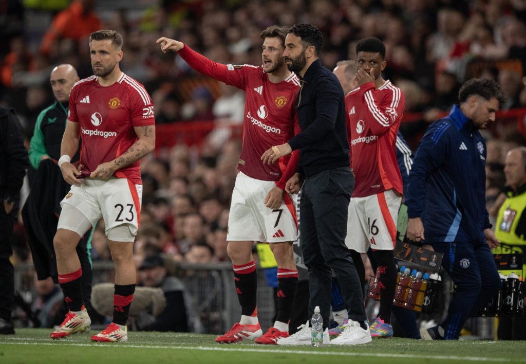 Manchester United manager Ruben Amorim and substitute Mason Mount talk during the Europa League match between Manchester United and Athletic Club at Old Trafford in 2025 in Manchester.