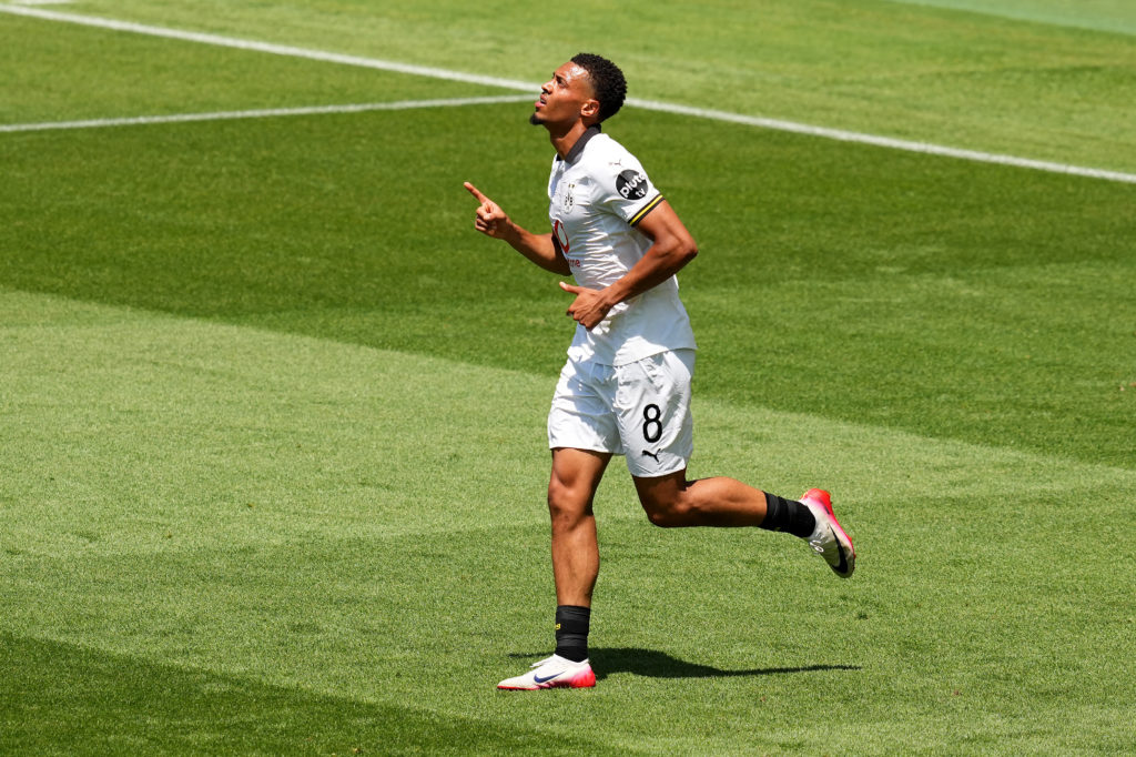 Felix Nmecha celebrates scoring for Borussia Dortmund.