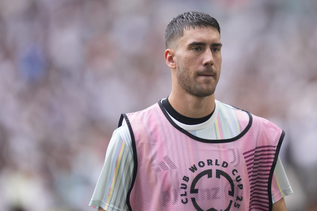 Juventus striker Dusan Vlahovic warms up against Real Madrid.