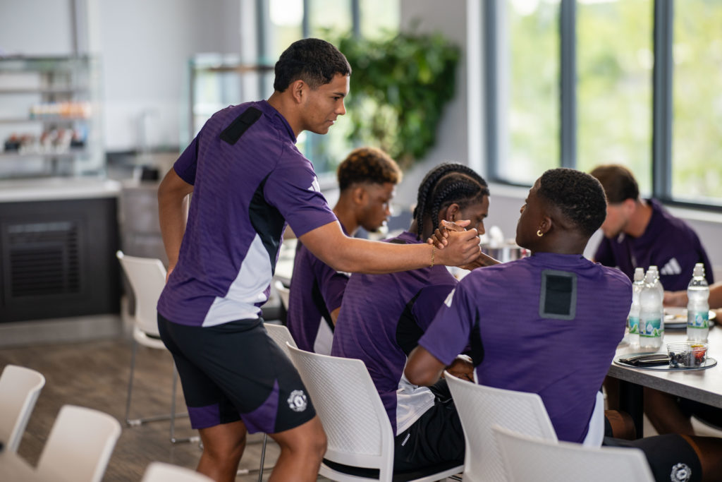 Manchester United players Diego Leon and Kobbie Mainoo arrive for the pre-season training at the Carrington complex in 2025 in Manchester.