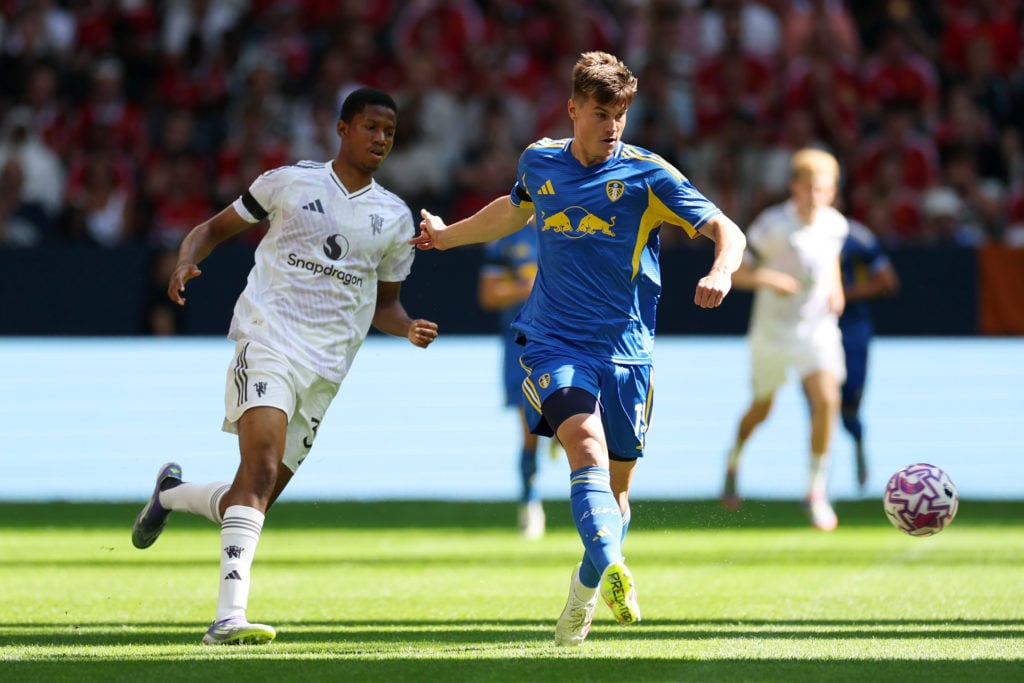 Jaka Bijol of Leeds United passes the ball whilst under pressure from Chido Obi of Manchester United during the pre-season friendly match between Manchester United and Leeds United at Strawberry Arena on July 19, 2025