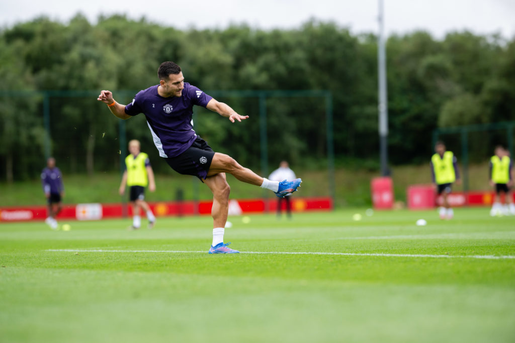 Diogo Dalot crossing during Manchester United training session.