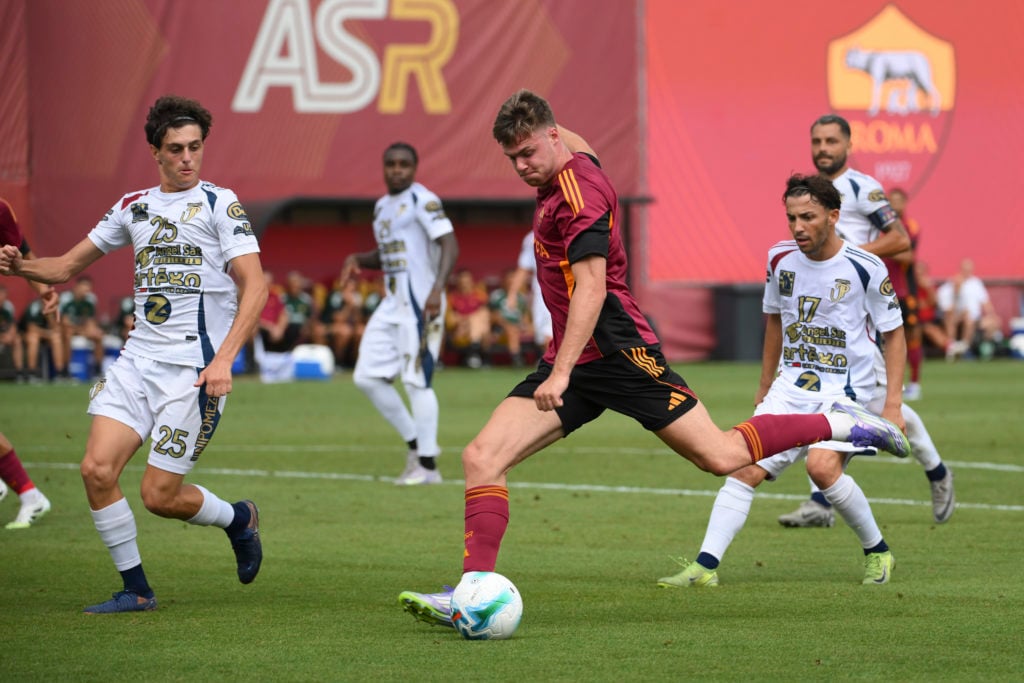 Evan Ferguson prepares to unleash a shot in Roma kit.