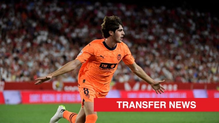 Valencia midfielder Javi Guerra celebrates scoring against Sevilla, with a red transfer news banner.