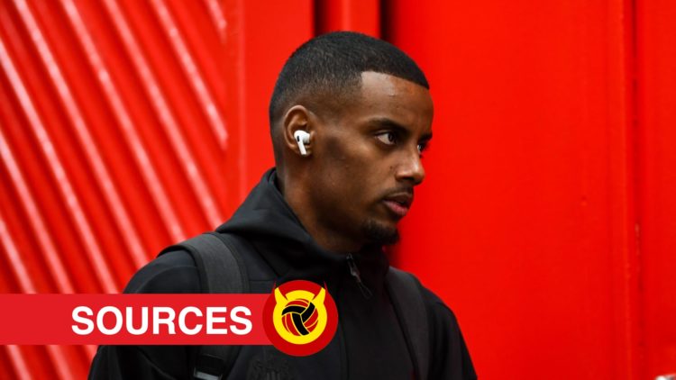 Alexander Isak arrives at Anfield with Newcastle team. Overlaid UIF logo and exclusives banner.