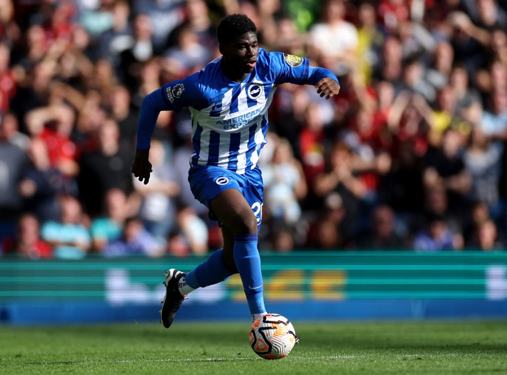 Carlos Baleba strides forward with the ball for Brighton