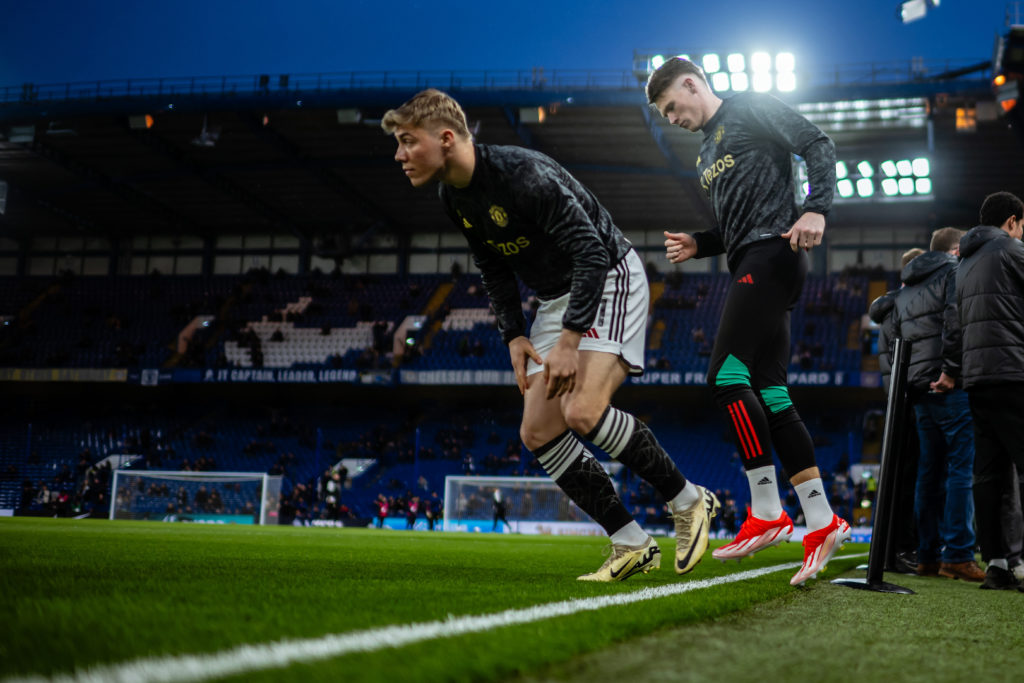 Rasmus Hojlund and Scott McTominay of Manchester United warm up ahead of the Premier League match between Chelsea FC and Manchester United at Stamford Bridge on April 04, 2024