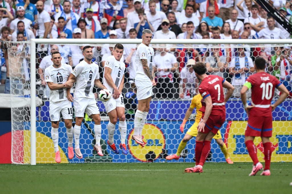 Benjamin Sesko alongside Jaka Bijol In Slovenia wall defending a free kick.